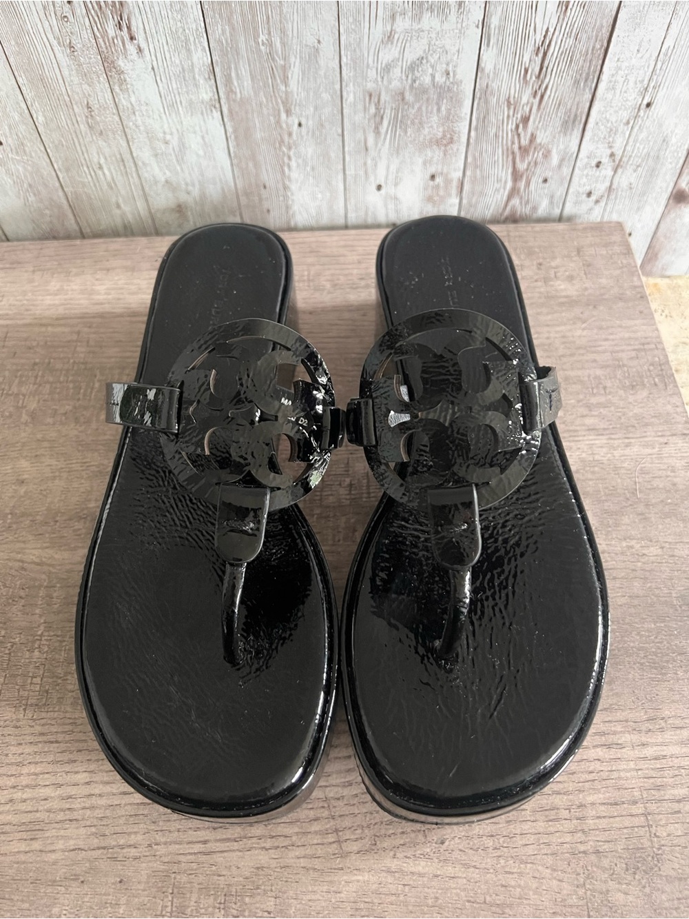 The iconic sandal with a cult following is updated with a comfortable wedge hee